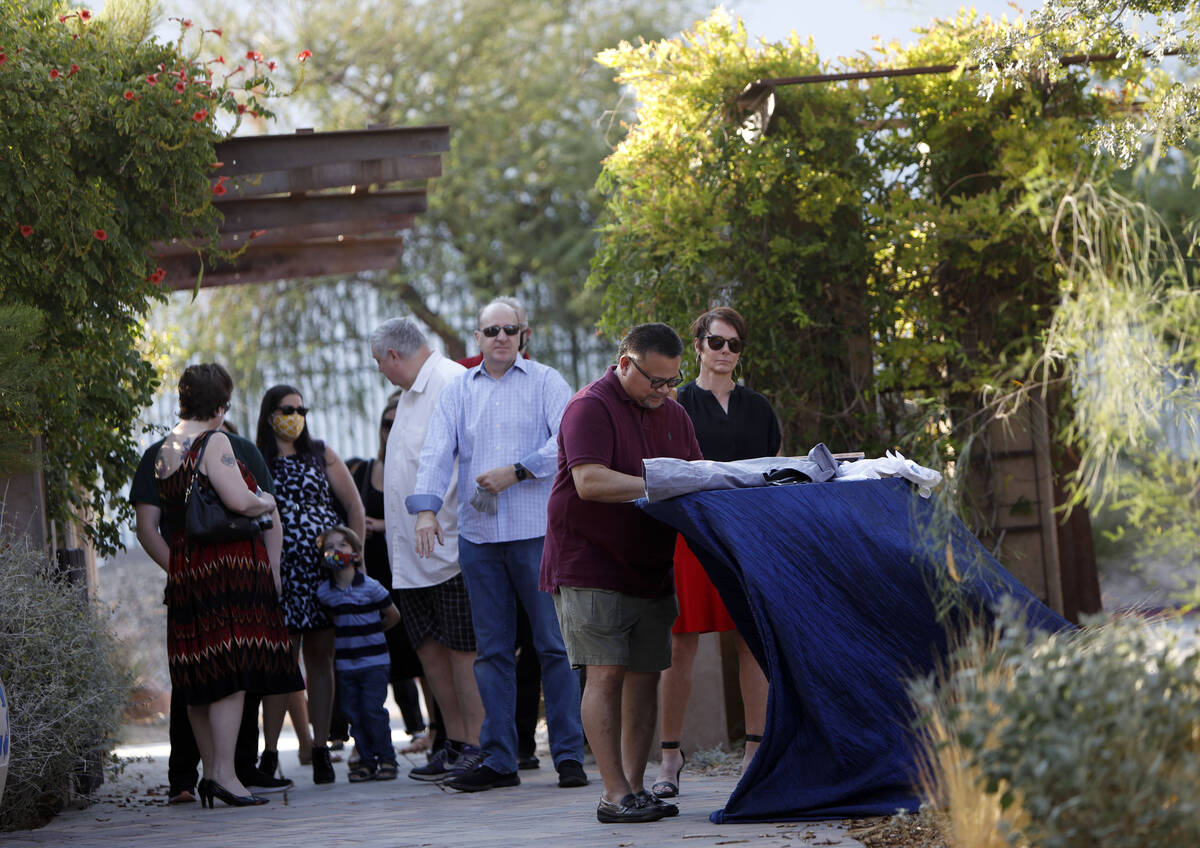 Guests arrive to attend a celebration of life marking the one-year anniversary of Greg Peistrup ...