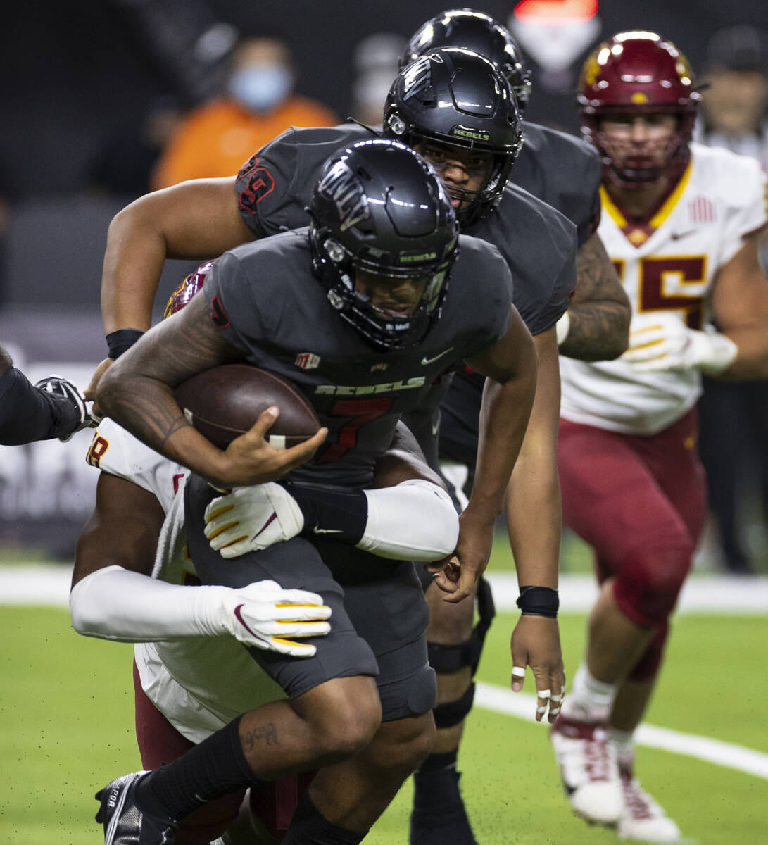 UNLV Rebels quarterback Cameron Friel (7) is sacked by Iowa State CycloneÕs defensive end Eyio ...