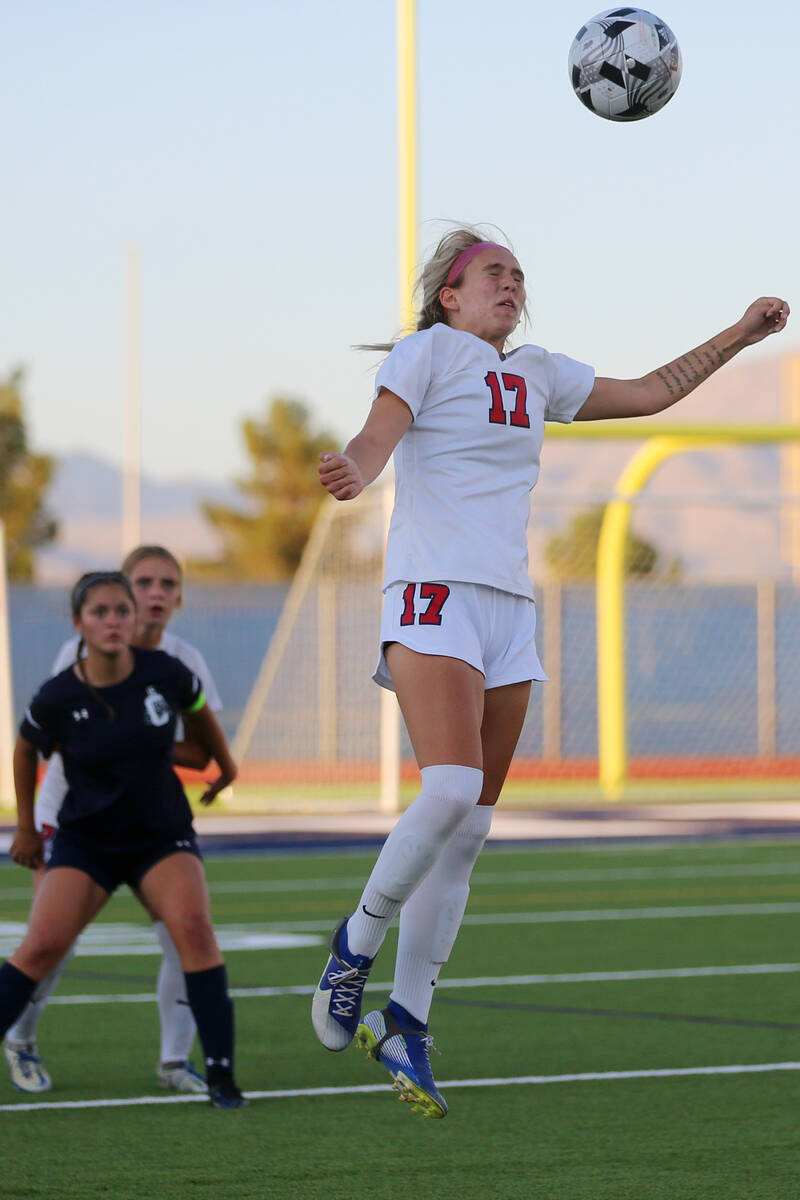 Coronado's Regan DiGulio (17) leaps for a header during the second half of a girl's soccer game ...