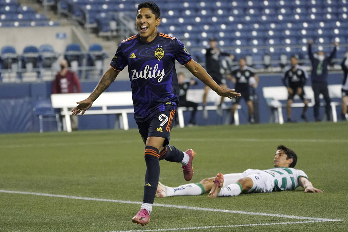 Seattle Sounders forward Raul Ruidiaz celebrates after he scored a goal past Santos Laguna midf ...