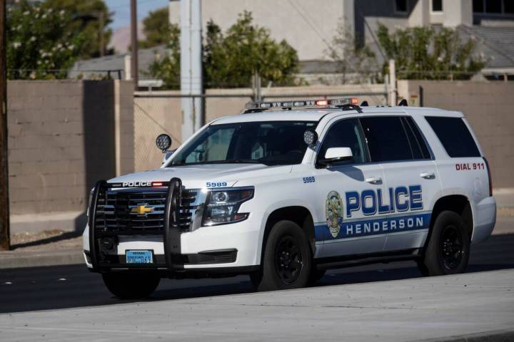 A Henderson Police Department vehicle arrives to the scene of a barricade on Charleston Avenue ...