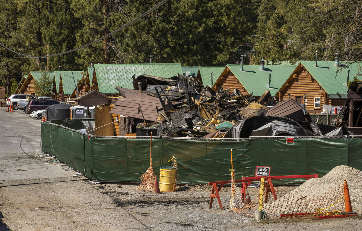 The burned remains of the Mount Charleston Lodge with remaining cabins to open again Friday for ...