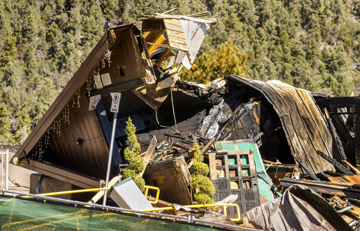 The burned remains of the Mount Charleston Lodge front entrance and other debris Wednesday, Sep ...