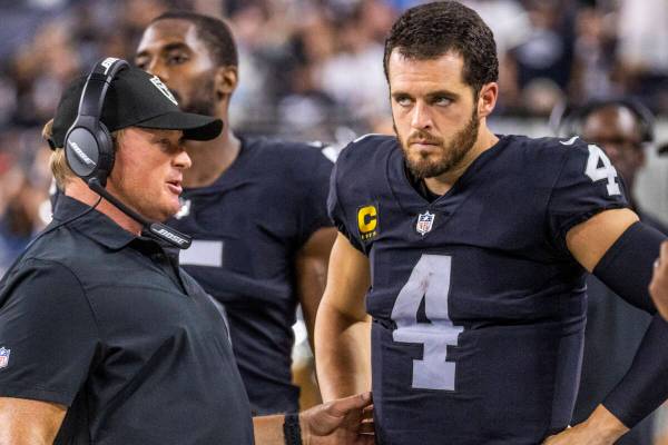 Raiders Head Coach John Gruden has a serious conversation with Raiders quarterback Derek Carr ( ...