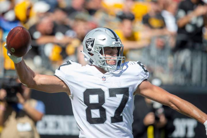 Raiders tight end Foster Moreau (87) prepares to spike the football after scoring a touchdown d ...