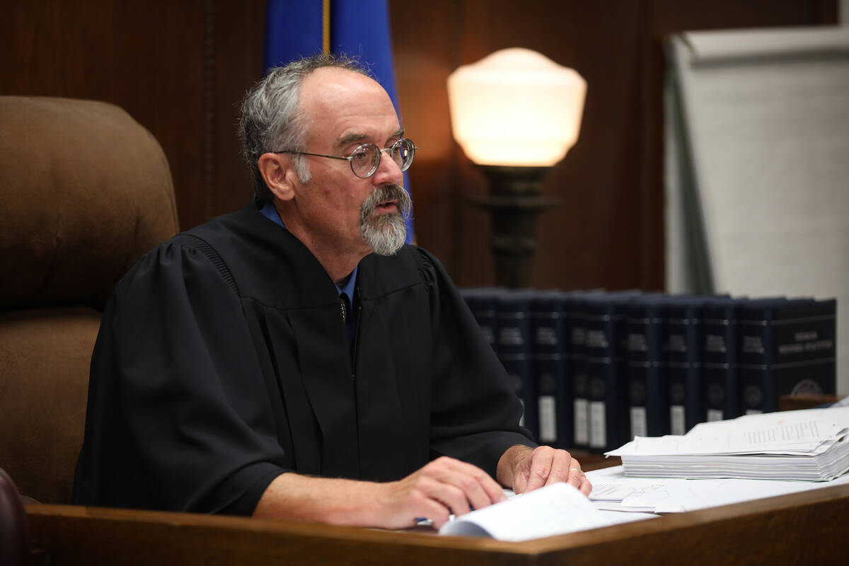 White Pine County District Judge Steve Dobrescu addresses the court during the sentencing of Jo ...