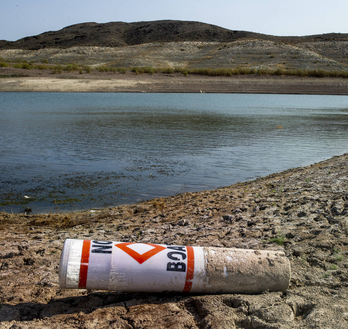 A buoy on the shore from low water near Boulder Harbor at Lake Mead National Recreation Area on ...