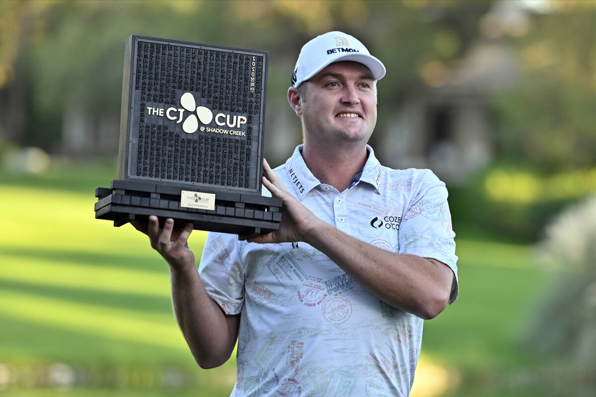Jason Kokrak holds the championship trophy after winning the CJ Cup golf tournament at Shadow C ...