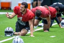 Raiders quarterback Derek Carr (4) yells to a teammate during warm ups for practice at the Inte ...