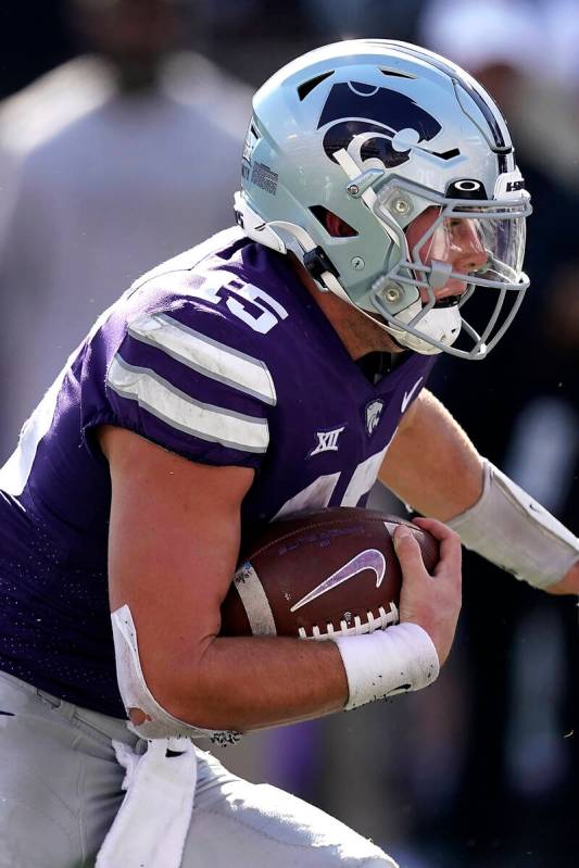 Kansas State quarterback Will Howard runs for a touchdown during the second half of an NCAA col ...