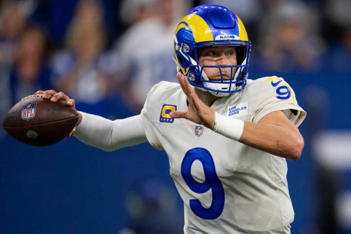 Los Angeles Rams quarterback Matthew Stafford (9) rthrows on the run during an NFL football gam ...