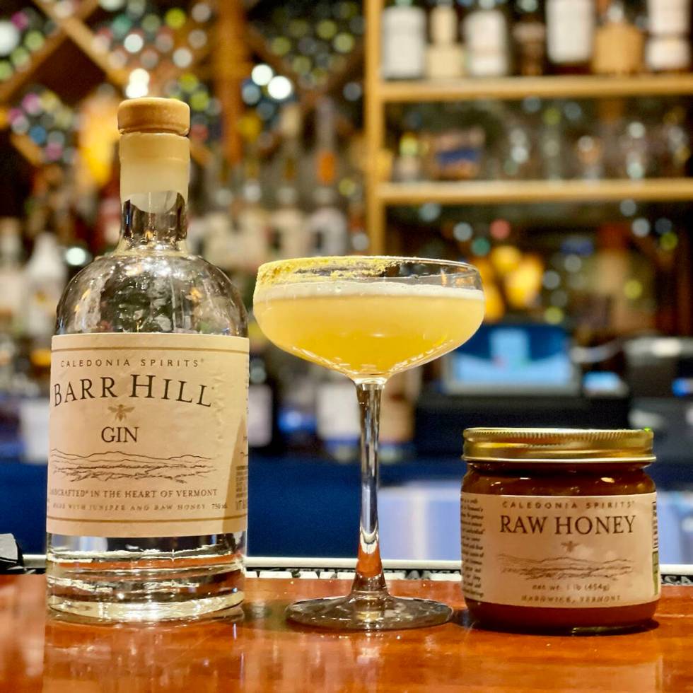The Bee's Knees at Lotus of Siam contains Barr Hill Gin, Caladonia Spirits raw honey infused wi ...
