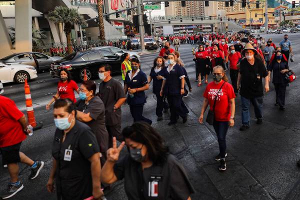 Members and supporters of the Culinary Workers Union Local 226 march the Strip to bring attenti ...