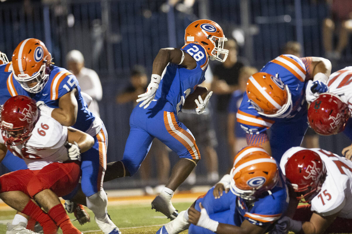 Bishop Gorman's Devon Rice (28) runs the ball for a touchdown against Arbor View during the fir ...