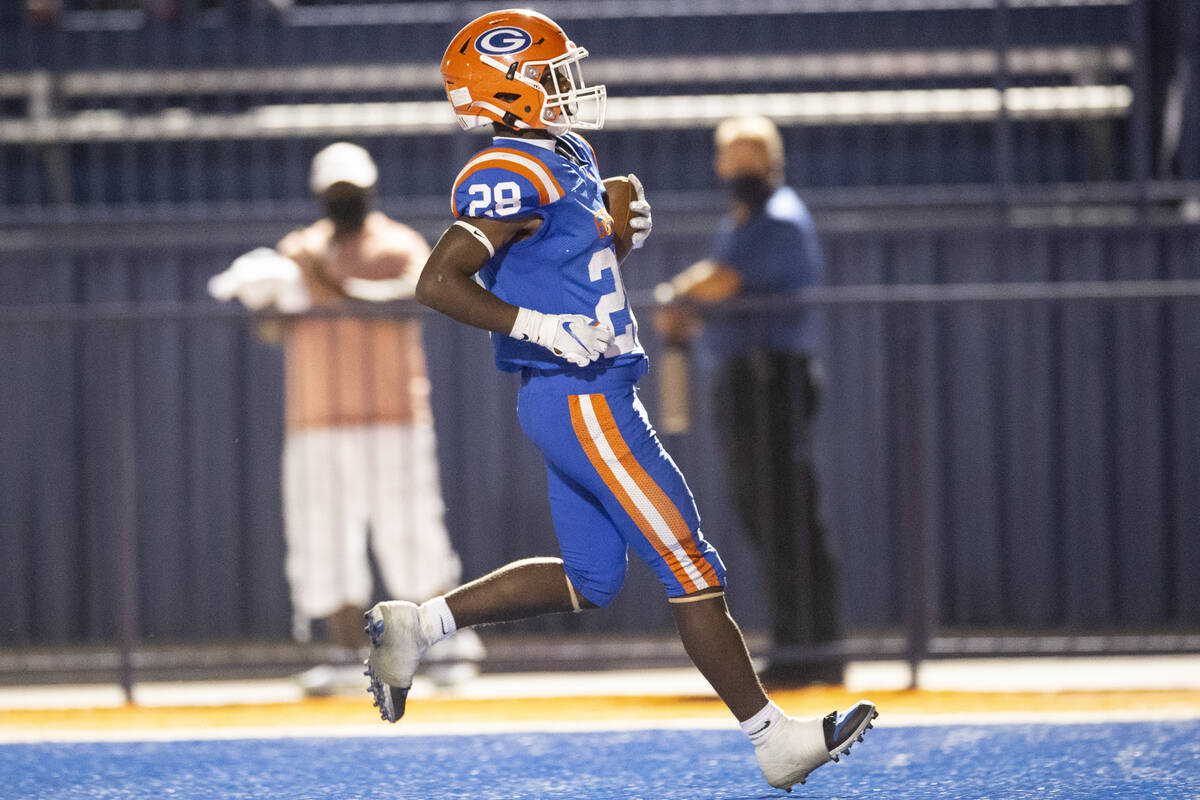 Bishop Gorman's Devon Rice (28) runs the ball for a touchdown against Arbor View during the fir ...