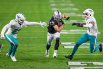 Raiders wide receiver Hunter Renfrow (13) runs after making a catch through Miami Dolphins corn ...
