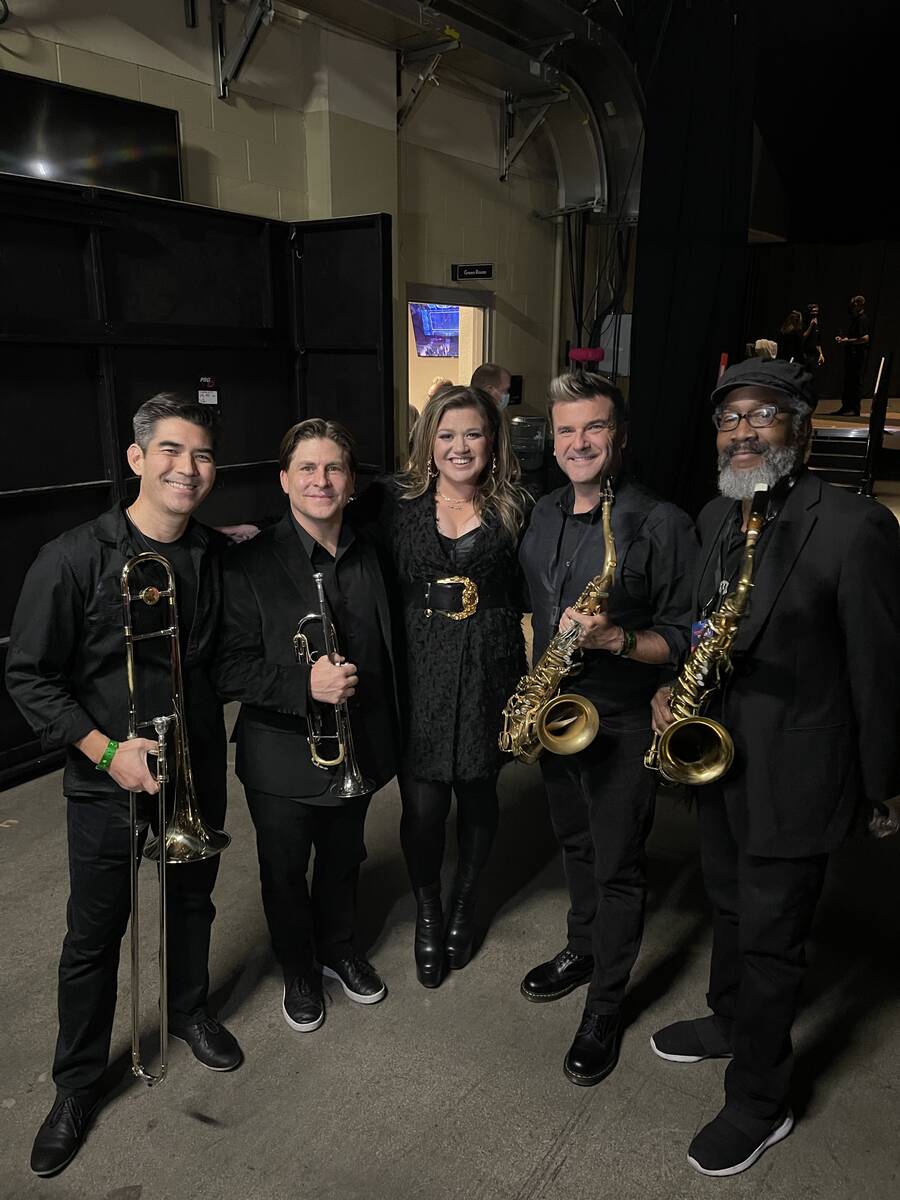 Nathan Tanouye, Daniel Falcone, Kelly Clarkson, Eric Tewalt and Phil Wigfall are shown at Miche ...