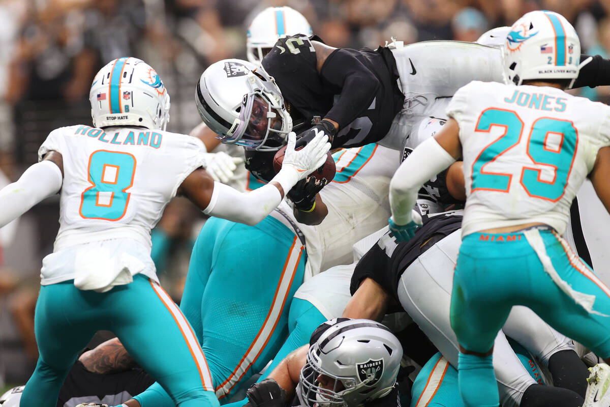 Las Vegas Raiders running back Peyton Barber (31) leaps for a touchdown in the second half of a ...