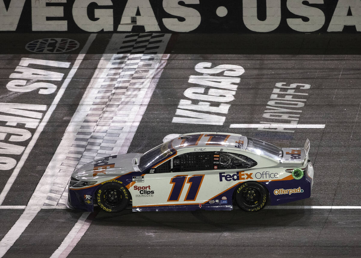 Denny Hamlin (11) crosses the finish line to win the 4th Annual South Point 400 at Las Vegas Mo ...
