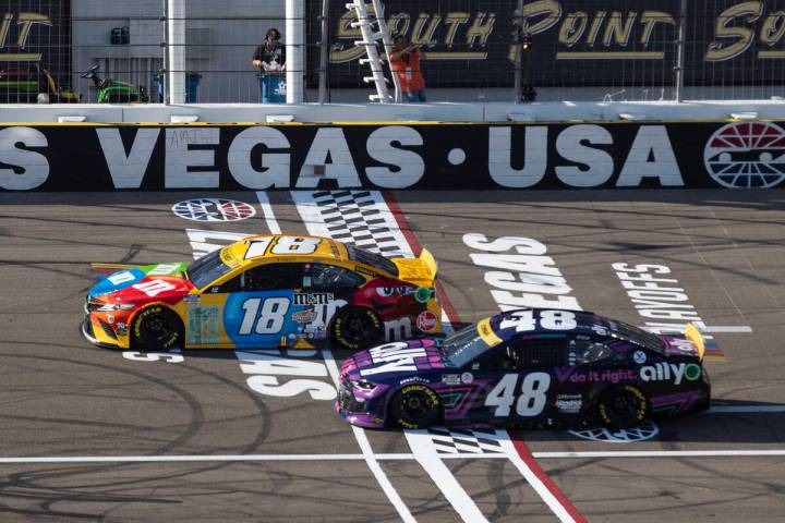 Kyle Busch (18) and Alex Bowman (48) race during the 4th Annual South Point 400 race at Las Veg ...