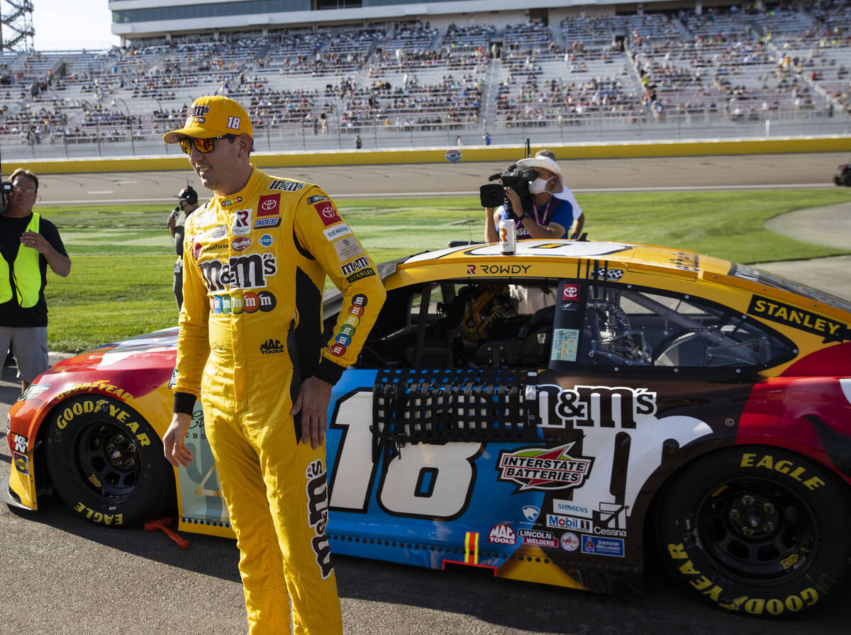Kyle Busch (18) stands next to his car prior to the start of the 4th Annual South Point 400 rac ...