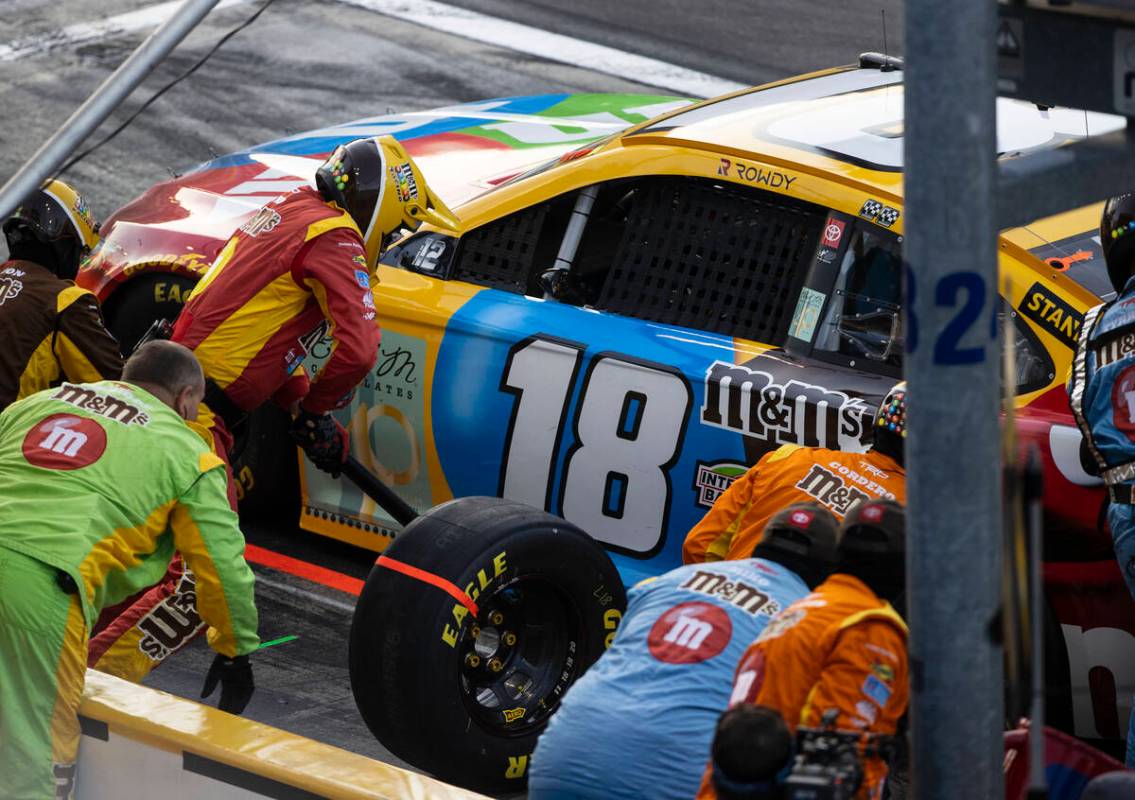 Kyle Busch (18) makes a pit stop during the 4th Annual South Point 400 race at Las Vegas Motor ...