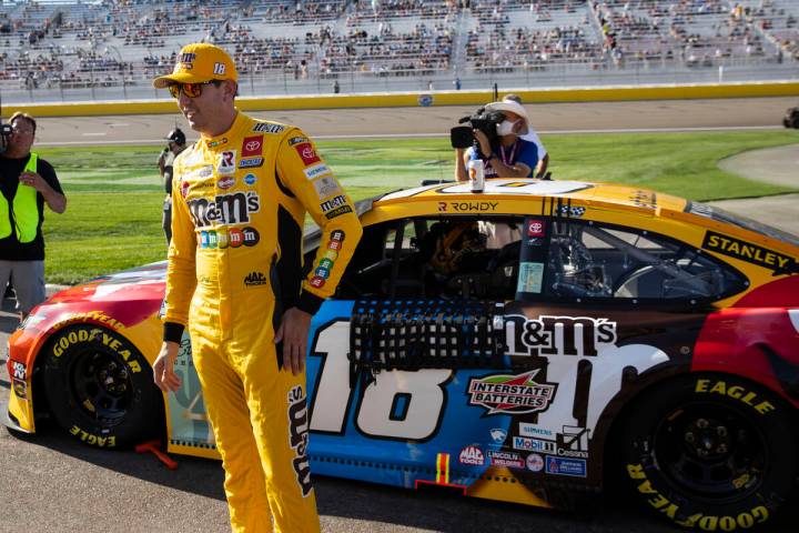 Kyle Busch (18) stands next to his car prior to the start of the 4th Annual South Point 400 rac ...