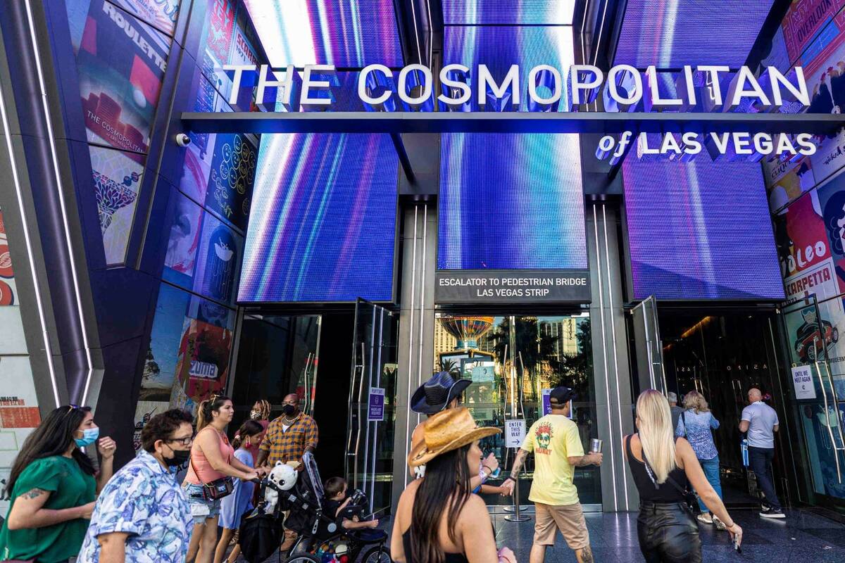 Pedestrians walk past The Cosmopolitan of Las Vegas on Monday, Sept. 27, 2021, in Las Vegas. (B ...