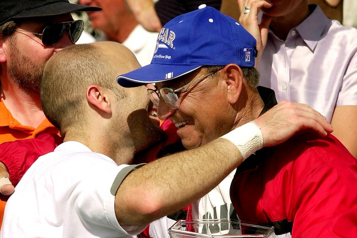 Andre Agassi hugs his dad, Mike Agassi, after defeating Juan Balcells during the final match of ...