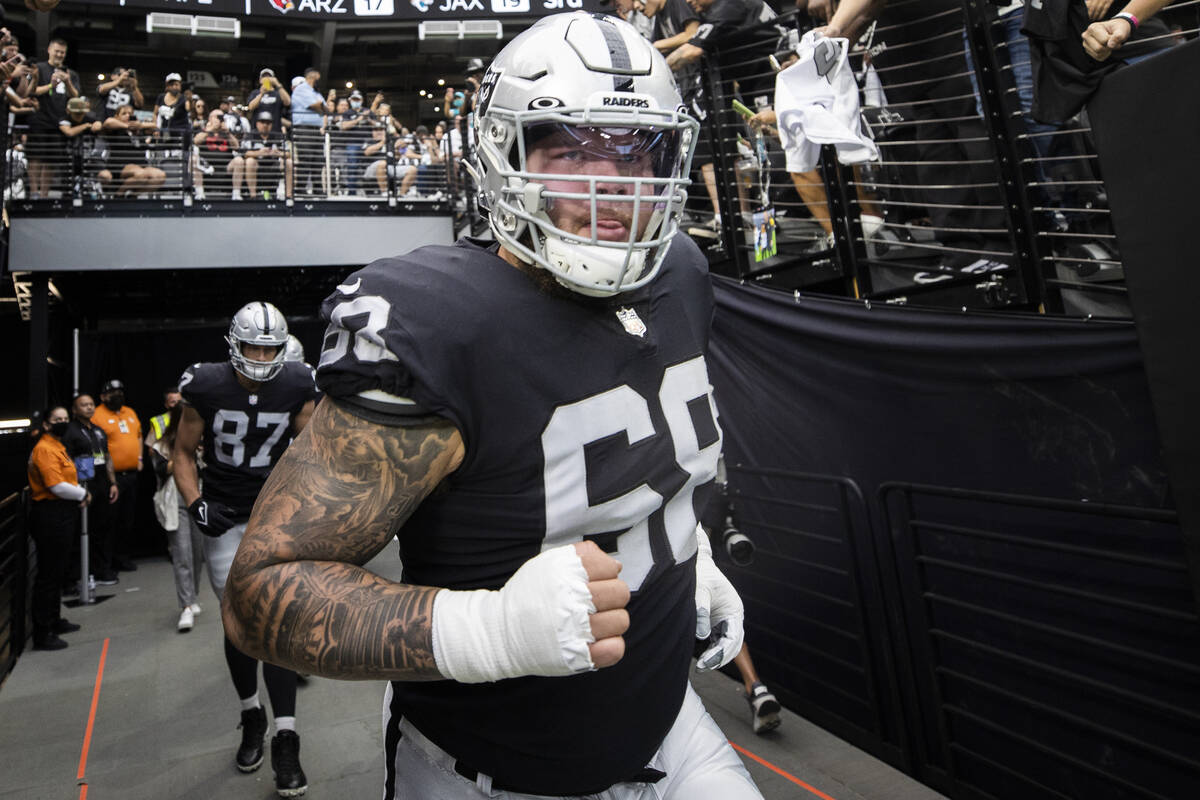 Las Vegas Raiders center Andre James (68) takes the field before the start of an NFL football g ...