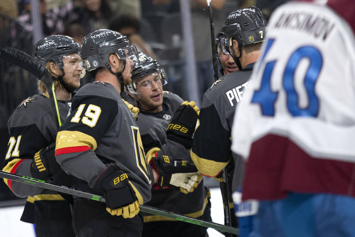 Golden Knights center Jonathan Marchessault (81) is congratulated by teammates including right ...