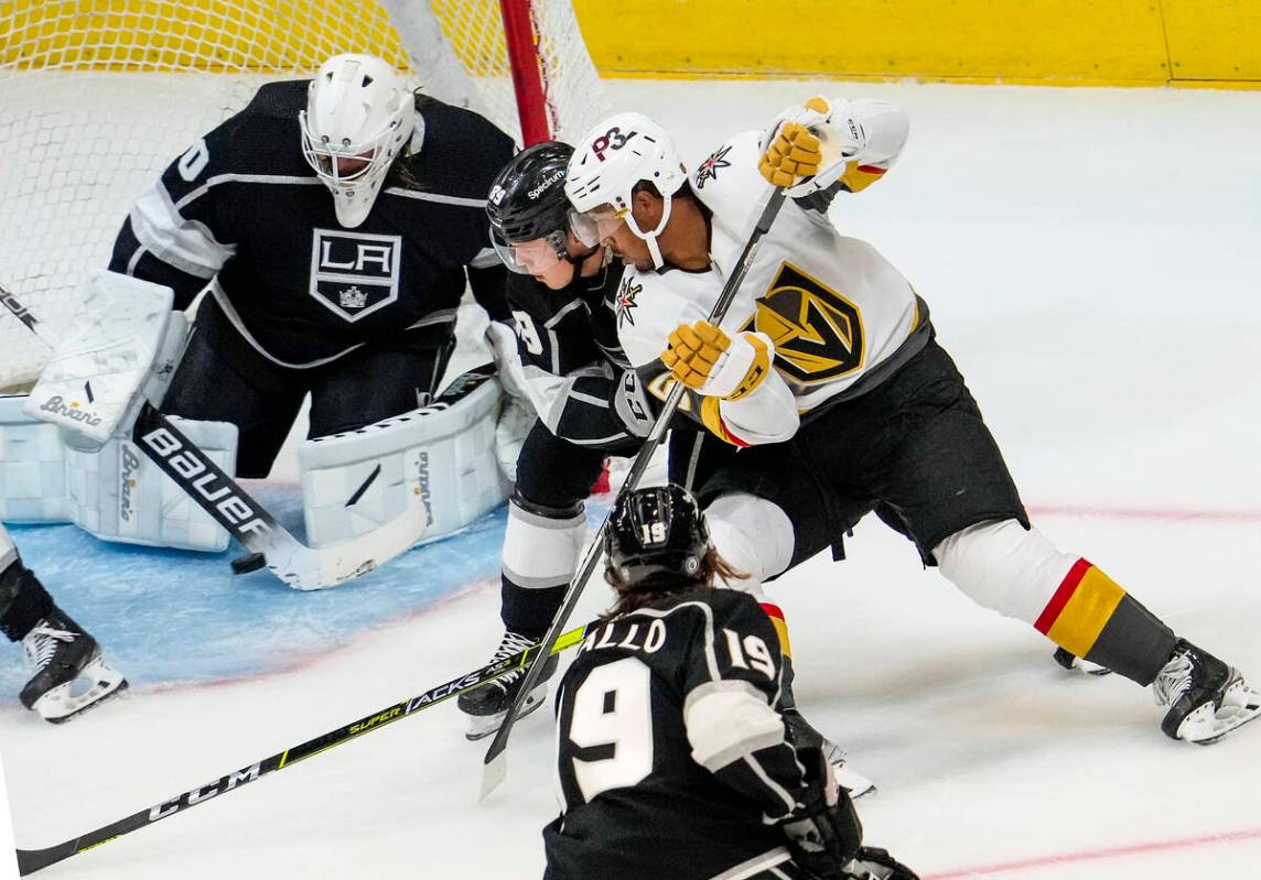 Vegas Golden Knights right wing Keegan Kolesar (55) shoots past Los Angeles Kings center Rasmus ...