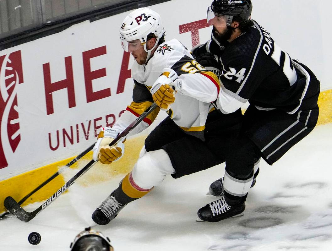 Vegas Golden Knights defenseman Dylan Coghlan (52) and Los Angeles Kings left wing Phillip Dana ...