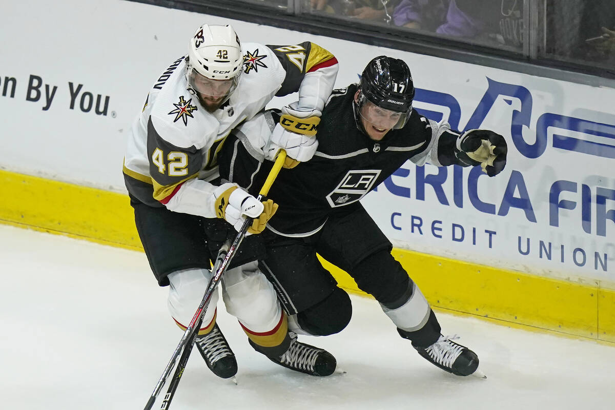 Vegas Golden Knights Daniil M Romanov (42) and Los Angeles Kings Lias Anderson (17) battle for ...