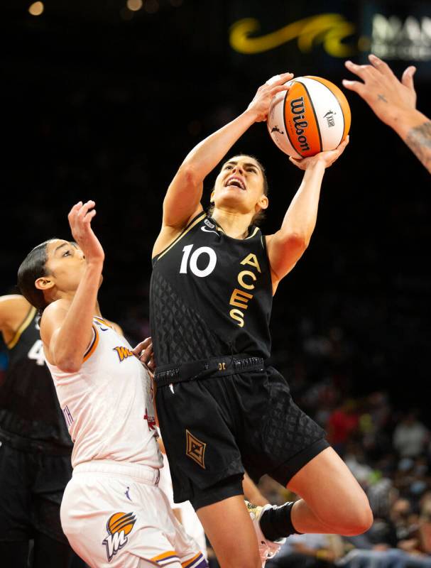 Las Vegas Aces guard Kelsey Plum (10) jumps to shoot as Phoenix Mercury guard Skylar Diggins-Sm ...