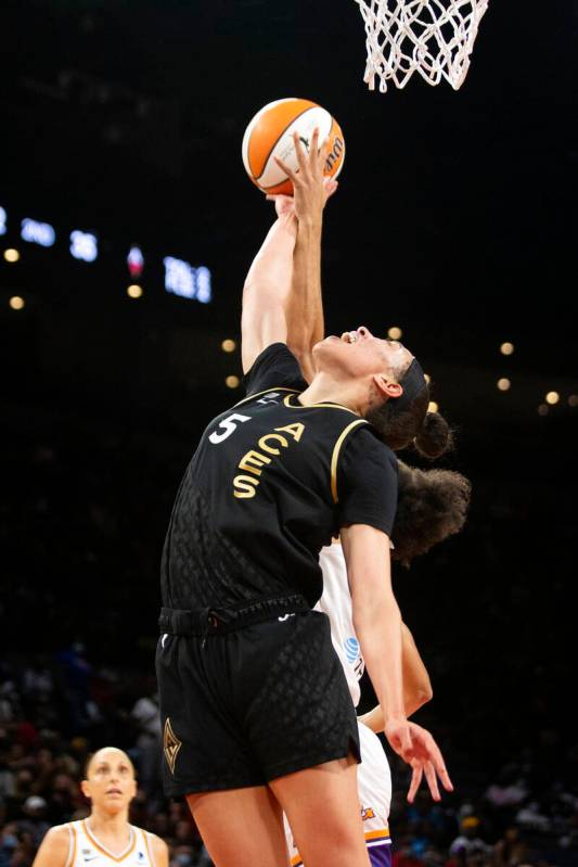 Las Vegas Aces forward Dearica Hamby (5) jumps to block Phoenix Mercury forward Brianna Turner ...