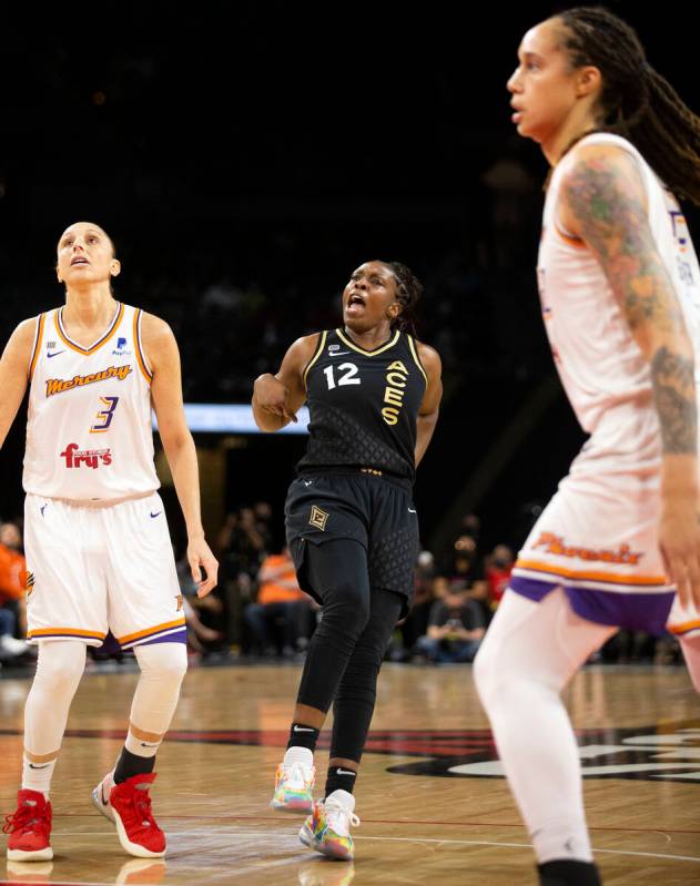 Las Vegas Aces guard Chelsea Gray (12) celebrates a successful three pointer while Phoenix Merc ...