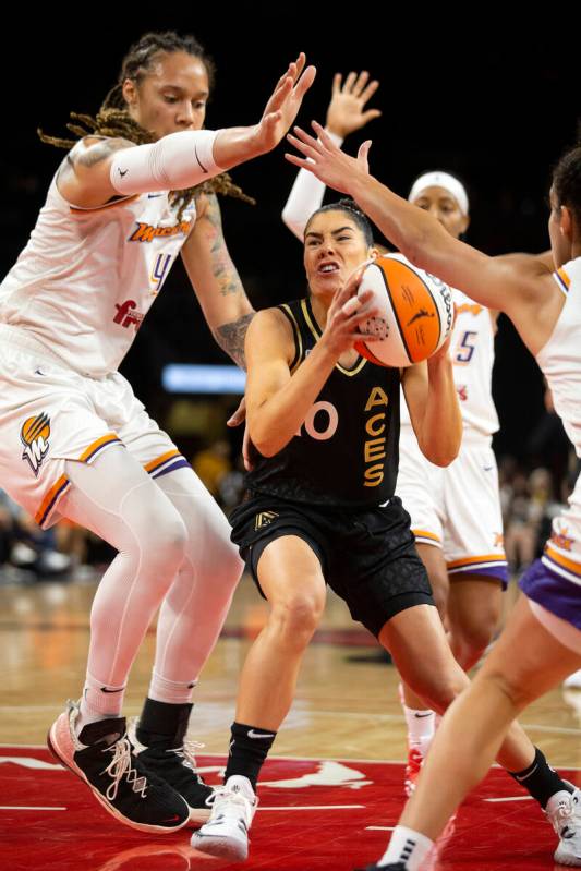 Las Vegas Aces guard Kelsey Plum (10) dribbles through Phoenix Mercury center Brittney Griner ( ...