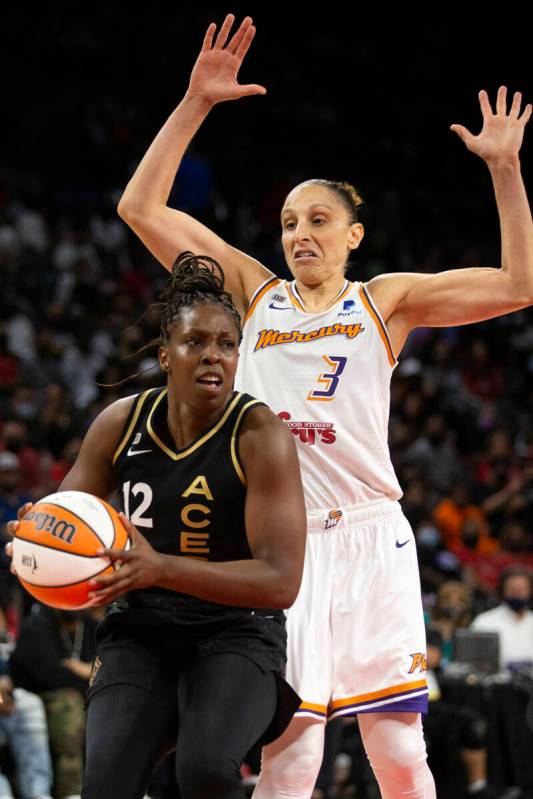 Las Vegas Aces guard Chelsea Gray (12) looks to pass while Phoenix Mercury guard Diana Taurasi ...