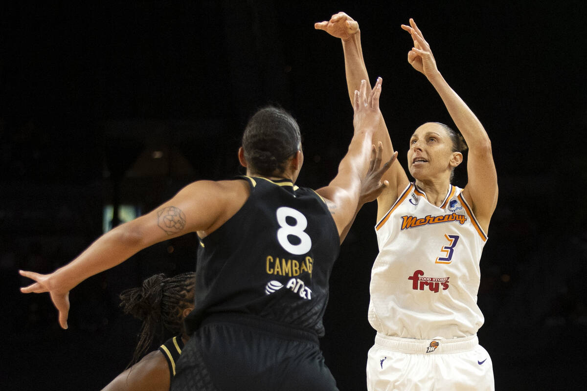 Phoenix Mercury guard Diana Taurasi (3) shoots a three pointer while Las Vegas Aces center Liz ...