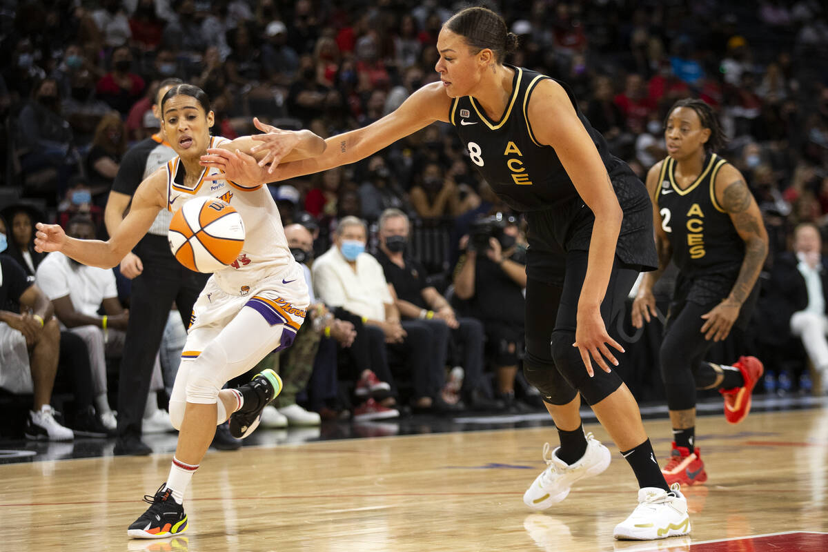 Phoenix Mercury guard Skylar Diggins-Smith (4) dribbles around Las Vegas Aces center Liz Cambag ...