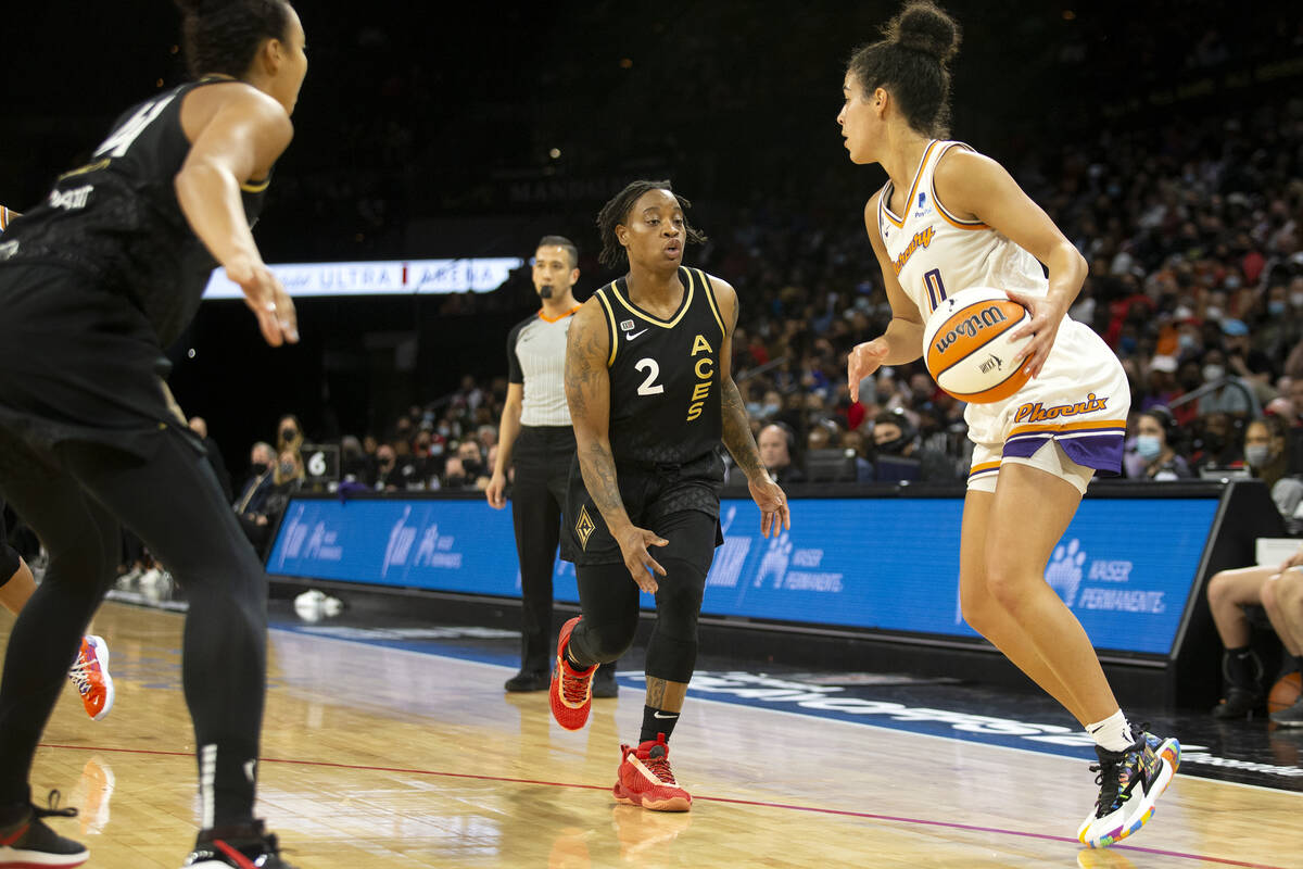 Las Vegas Aces center Kiah Stokes (41) and guard Riquna Williams (2) guard Phoenix Mercury guar ...