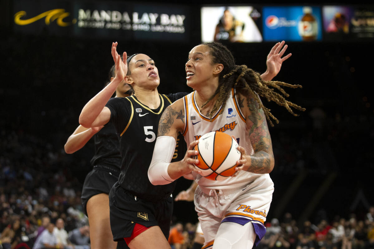 Phoenix Mercury center Brittney Griner (42) gains control of the ball as Las Vegas Aces forward ...