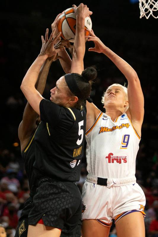 Las Vegas Aces forward Dearica Hamby (5) and Phoenix Mercury guard Sophie Cunningham (9) compet ...