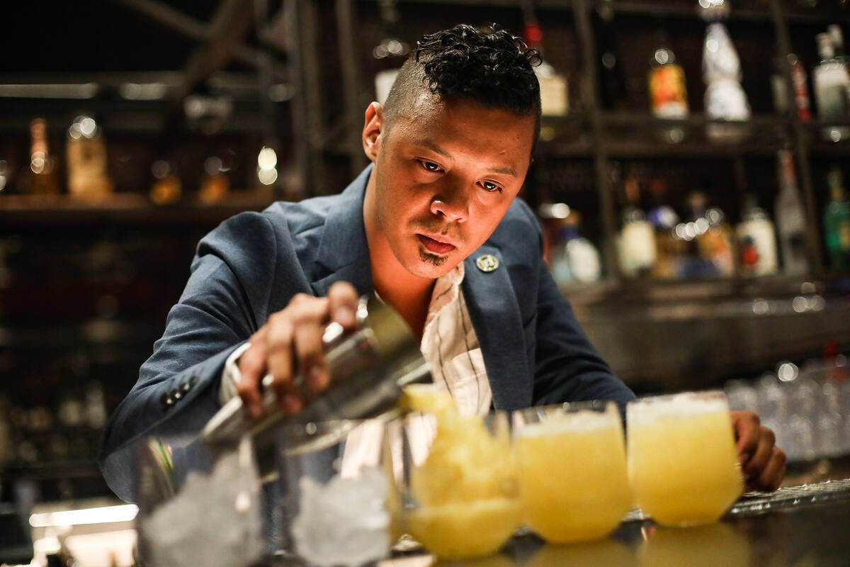 Ricky Lin, director of sales for Singani 63 pours the cocktail called ÒAnywhereÓ&#xd1 ...