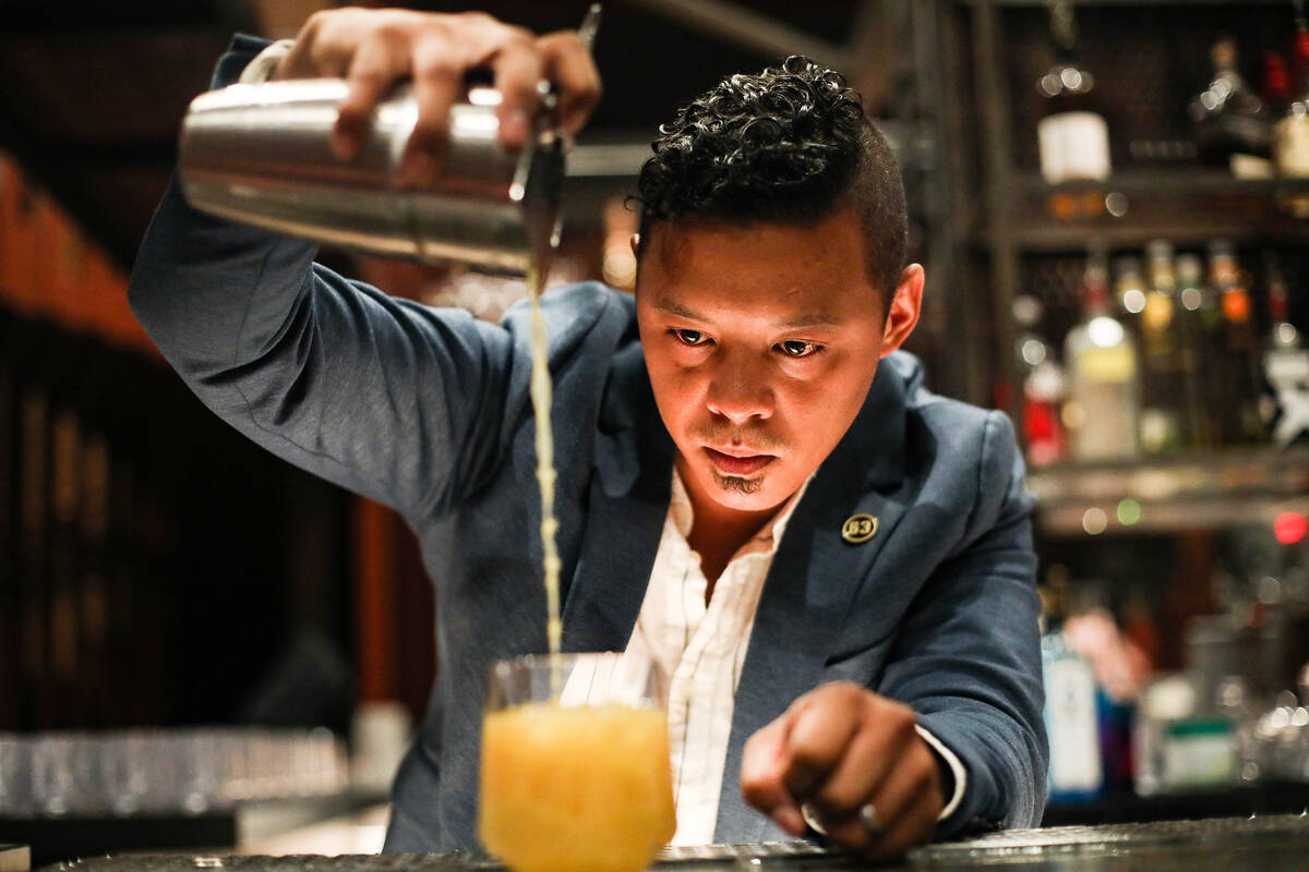 Ricky Lin, director of sales for Singani 63 pours the cocktail called ÒAnywhereÓ&#xd1 ...