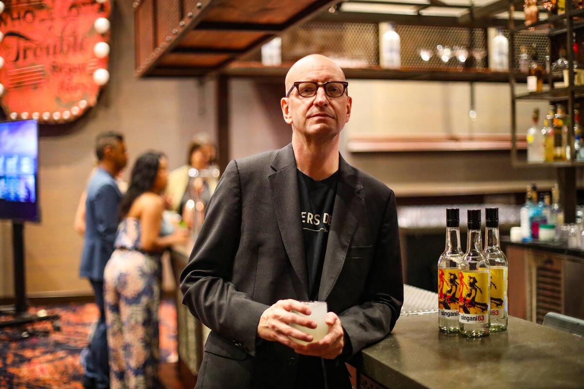 Oscar-winning director Steven Soderbergh stands next to bottles of Singani 63, a liquor brand h ...