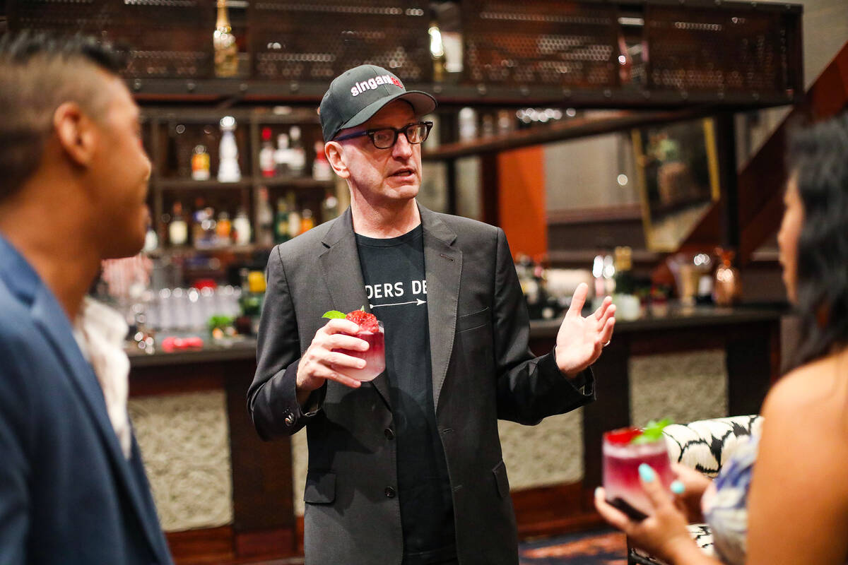 Oscar-winning director Steven Soderbergh talks with a local bartender while promoting the liquo ...