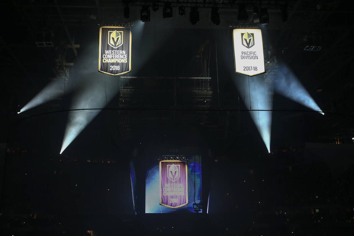 Pacific Division and Western Conference championship banners are raised during a season-opening ...