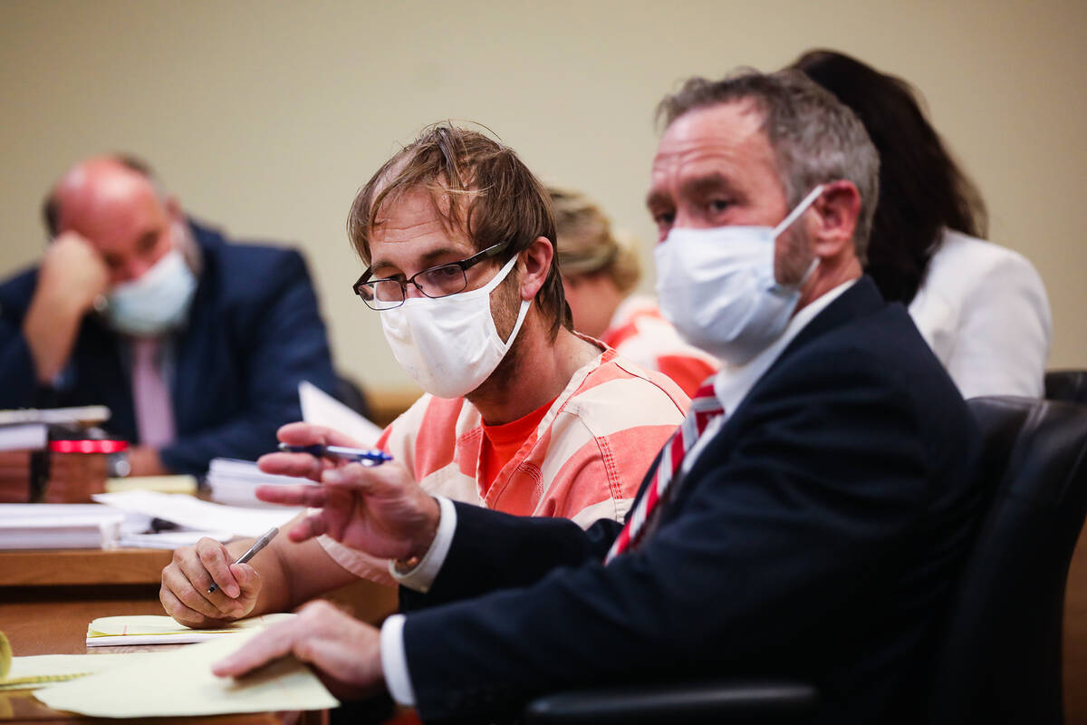 Brad Mehn, center, who with two others is charged in the killing of 27-year-old Roy Jaggers, si ...